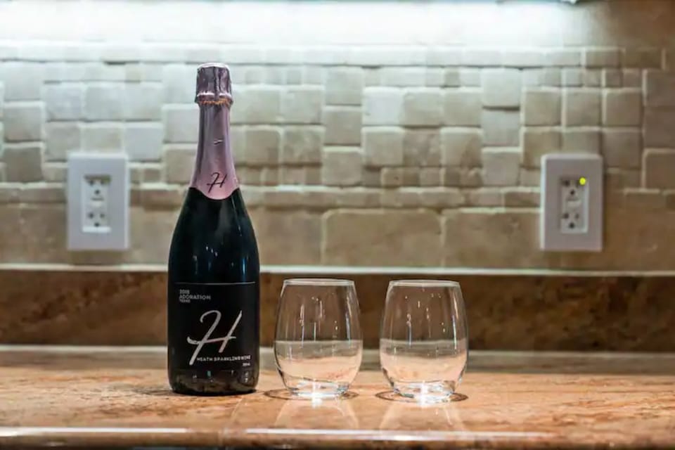 Kitchen has stemless wine glasses and a decanter for you to use
