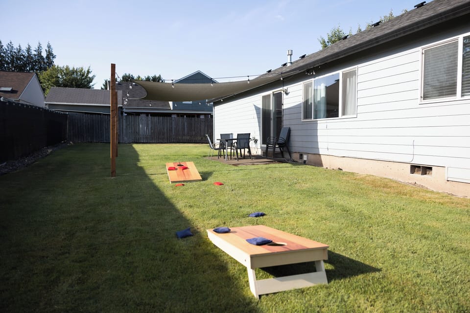 Cornhole is available for the warm months along with a large fully fenced yard.