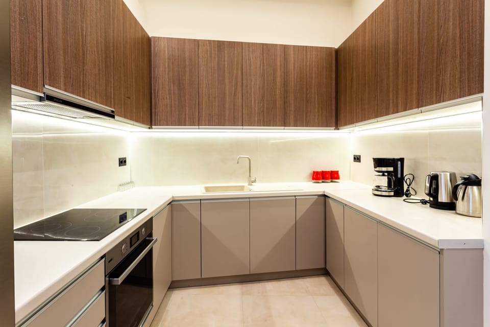 Fully Equipped Modern Kitchen with Sleek Cabinets and Appliances