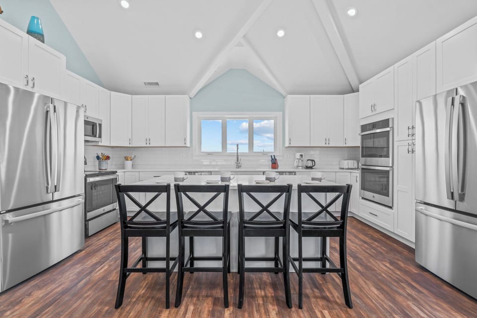 Whip up meals in the open and well-equipped kitchen, located on the top level.