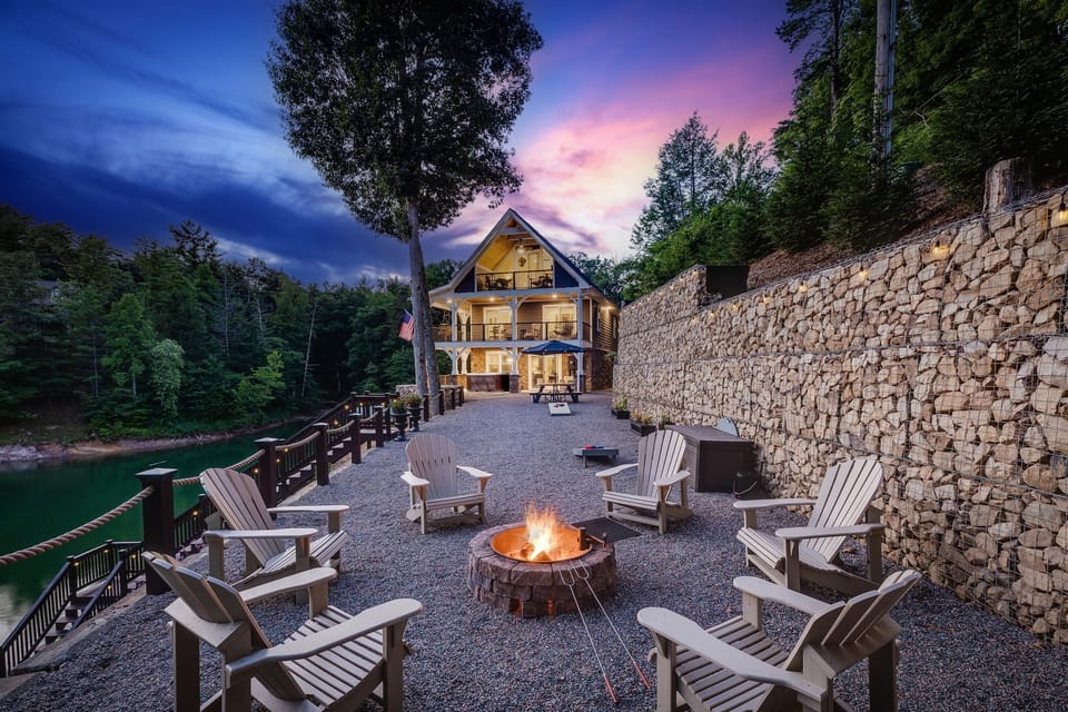 Summer at Skipping Stones Getaway Backyard with hot tub, fire pit, wood, roasting forks, corn hole boards, picnic table