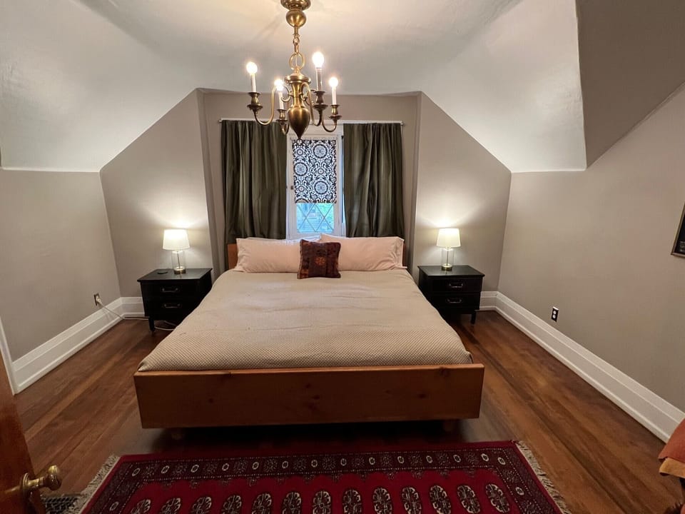 Upstairs bedroom with King size bed, and closet for storage. 