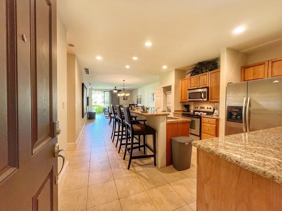 Accessible, ground-floor access opens to this large condo with full kitchen, dining table, living space and two bedrooms.