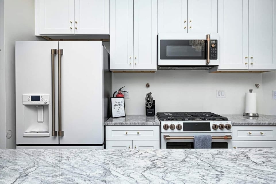 The kitchen is fully stocked with dishware, silverware, coffee mugs, & wine glasses.  The coffee bar has ground coffee, sugar, stevia, creamers & a drip coffee maker.
