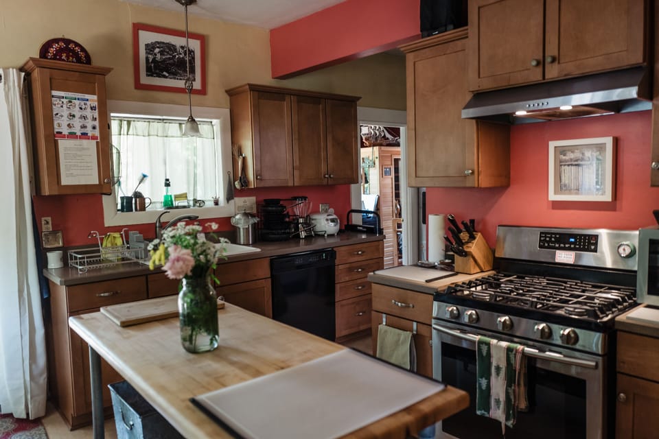 Fully equipped chef's kitchen with Allclad and cast iron pots and pans. 