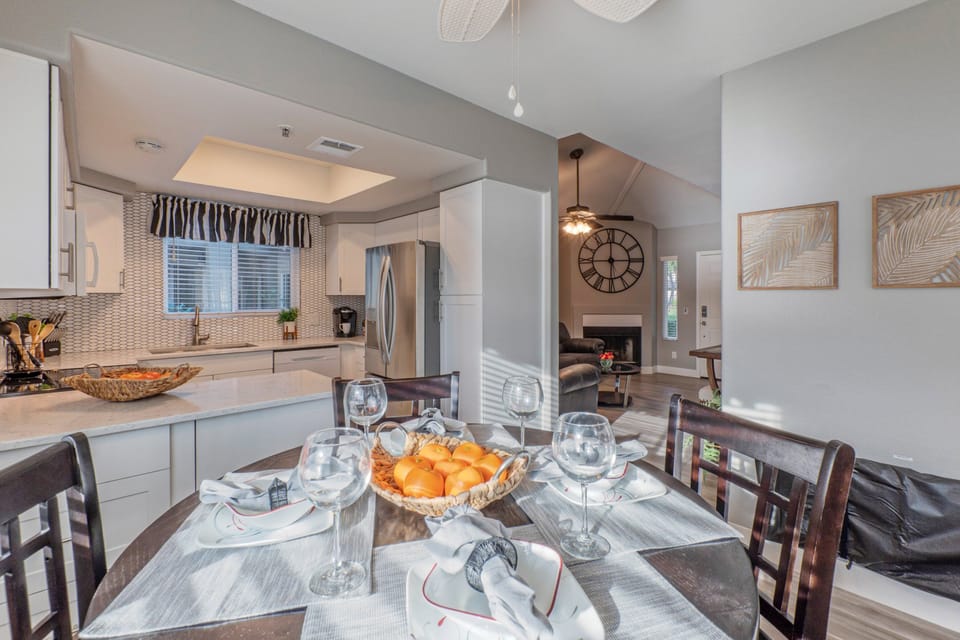 Completely stocked kitchen has table seating for 4.