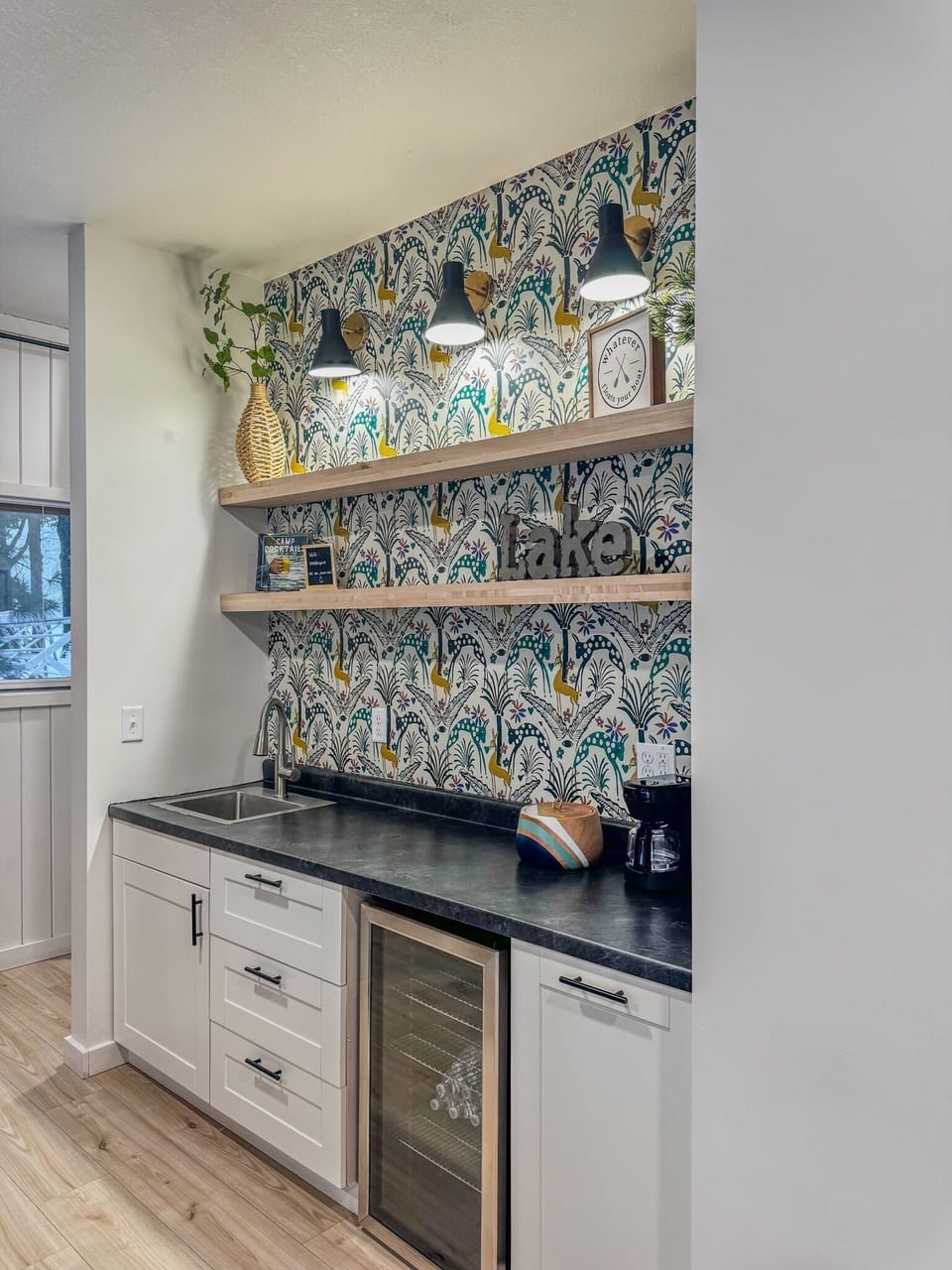 Wet bar including, sink, coffee maker, mini fridge and games