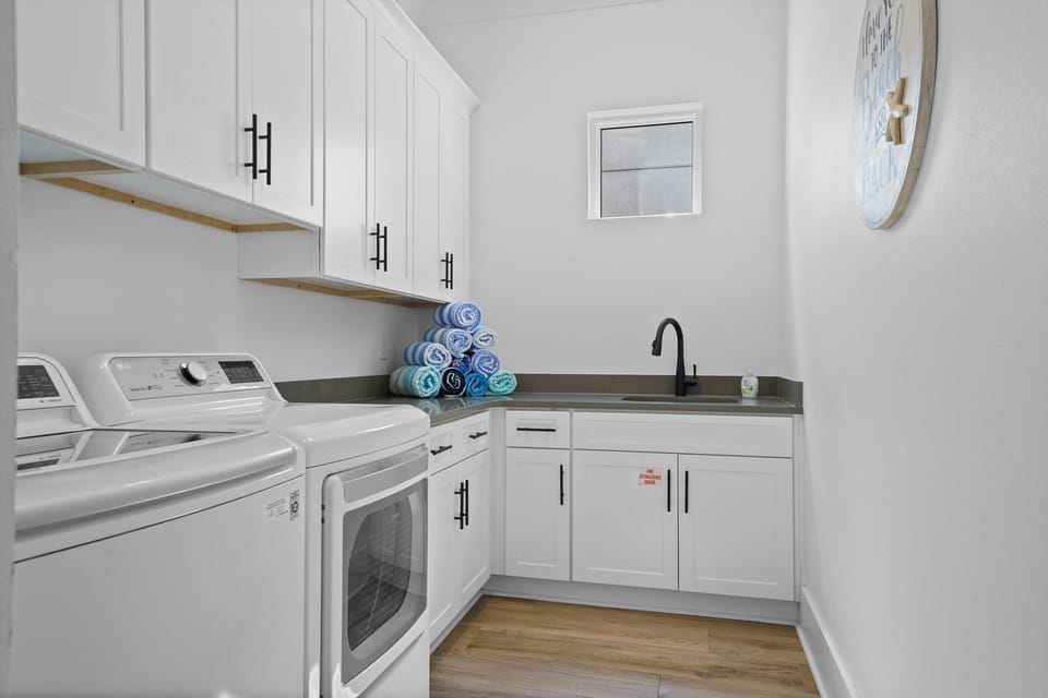 Ample storage in the first of two laundry rooms.