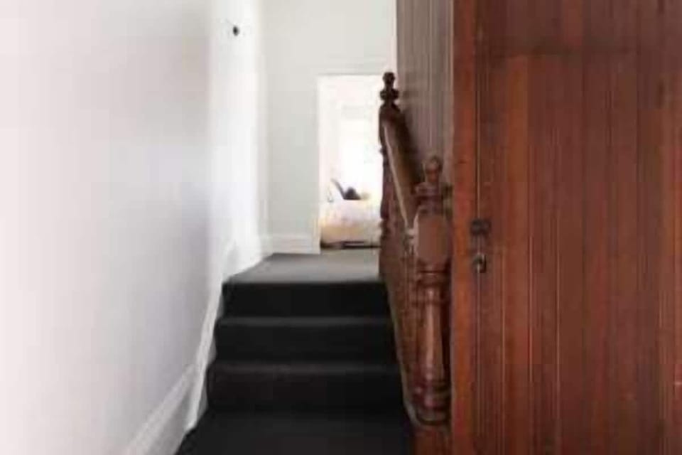 Make your way down the internal hallway staircase