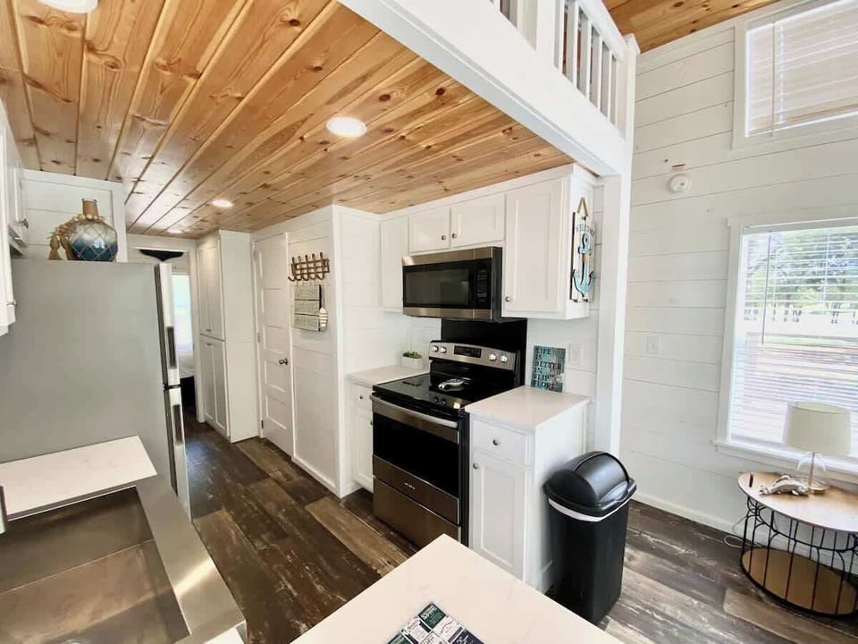 The kitchen features full size appliances.