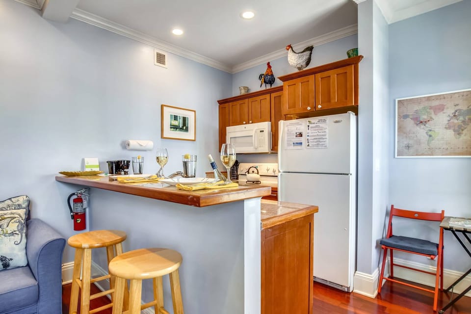 Kitchen features a countertop breakfast bar.