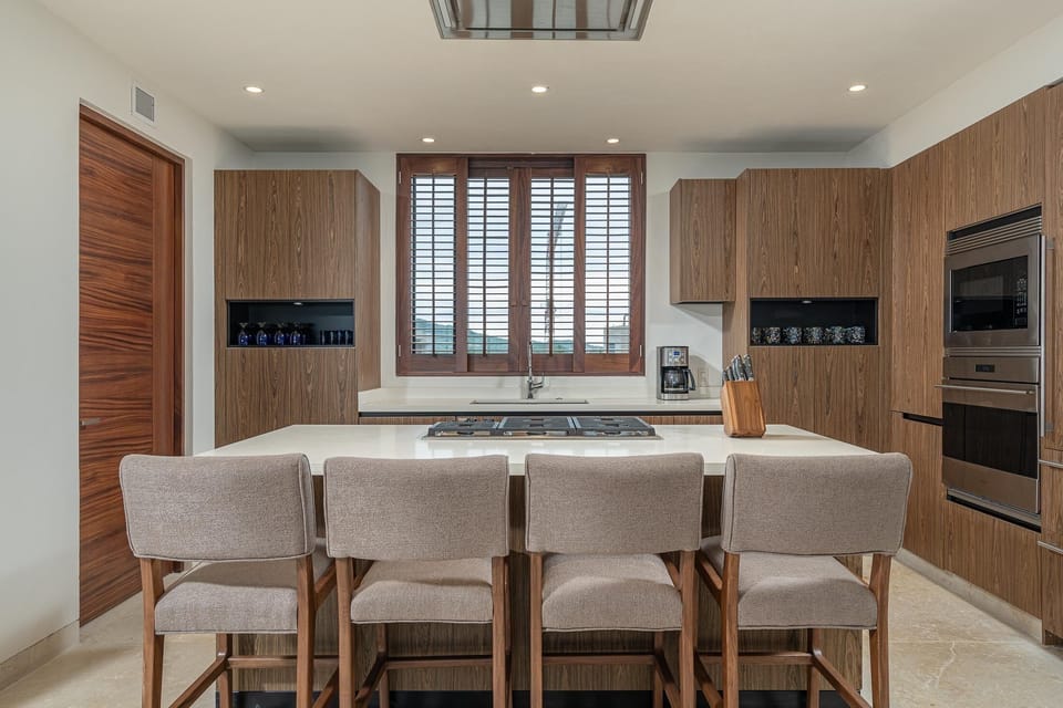 Dine in chef’s kitchen with Sub Zero and Wolf appliances.