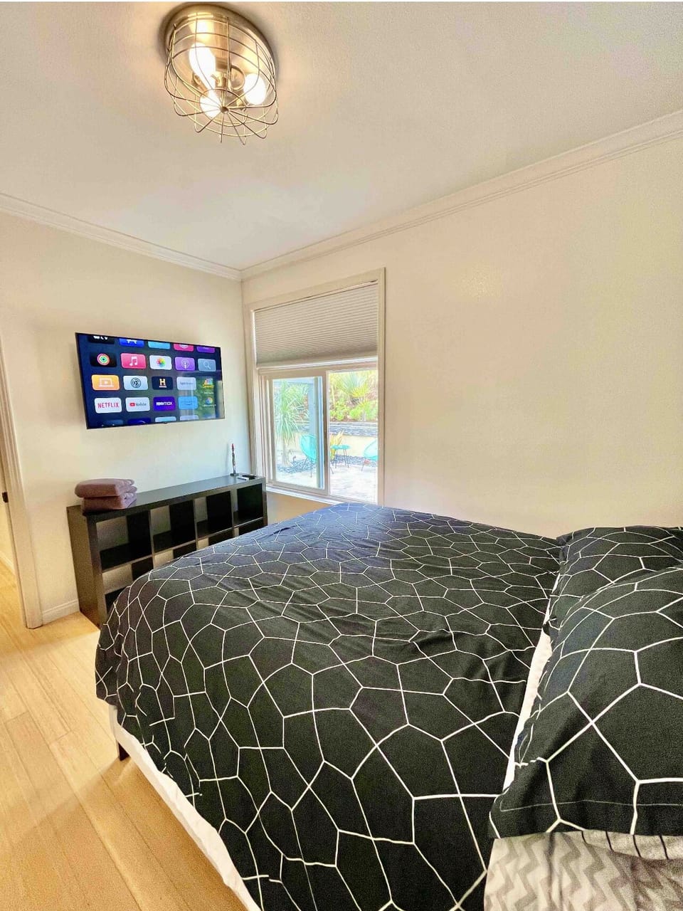 Main Floor Bedroom with Queen Size Bed and Television. Bedroom 3 of 4