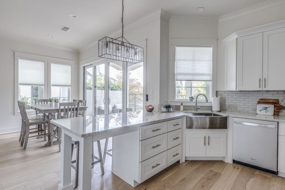 The kitchen overlooks the dining room and back patio. 