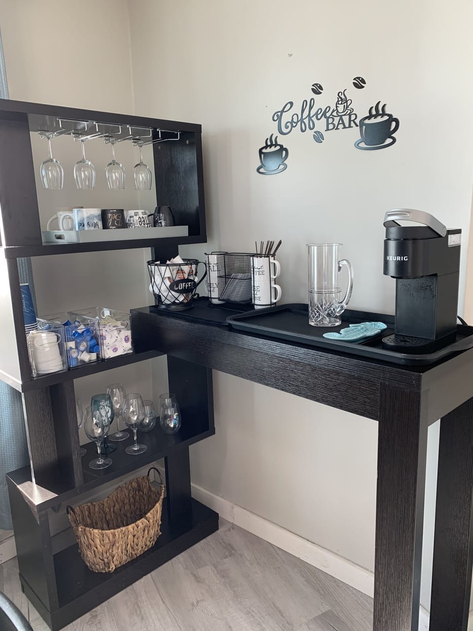 Keurig Coffee Bar stocked with coffee, creamer and sugar.