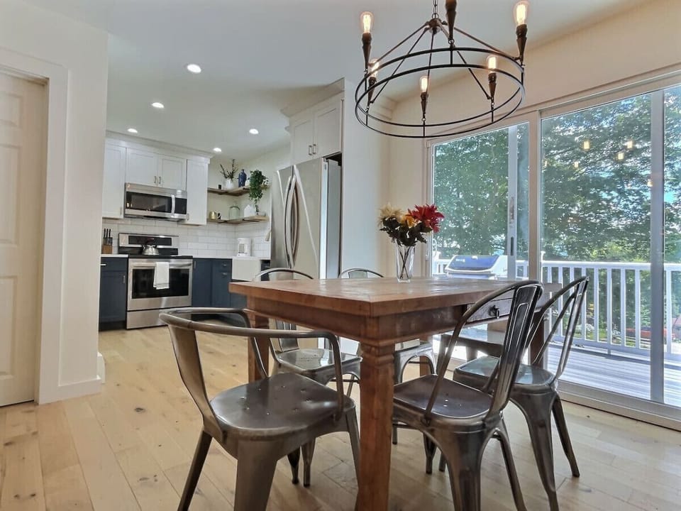 Savor meals and conversations in our elegant dining area with a stunning view of nature outside.