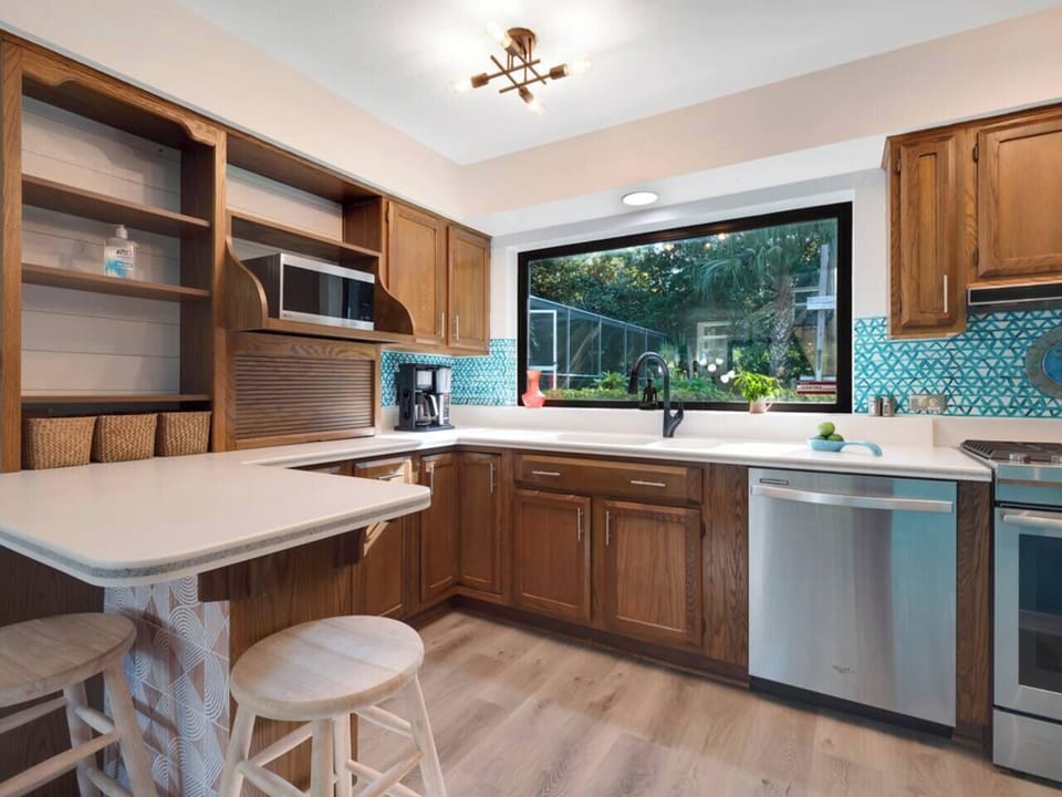 Kitchen has great natural light and high end appliances.