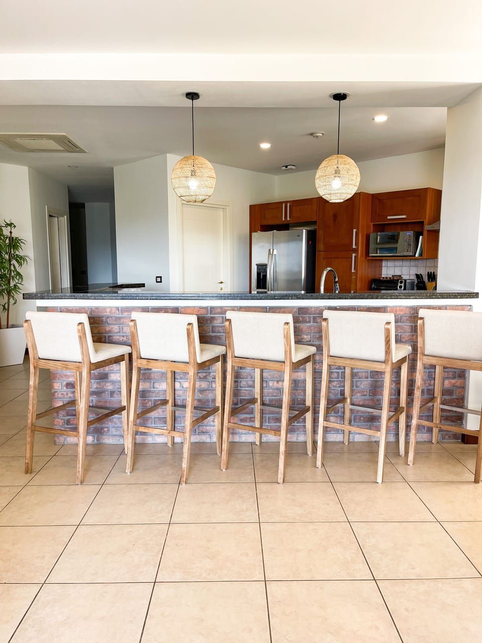 Island with new custom teak stools and seating for 5