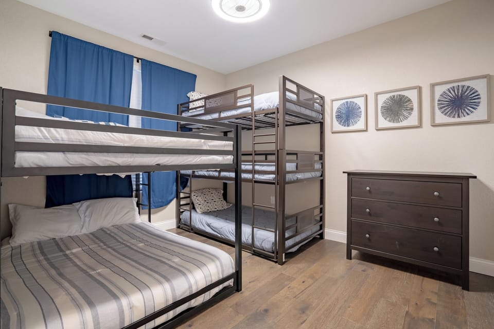 Bunk room with triple twin beds and double full beds - every kid's dream!