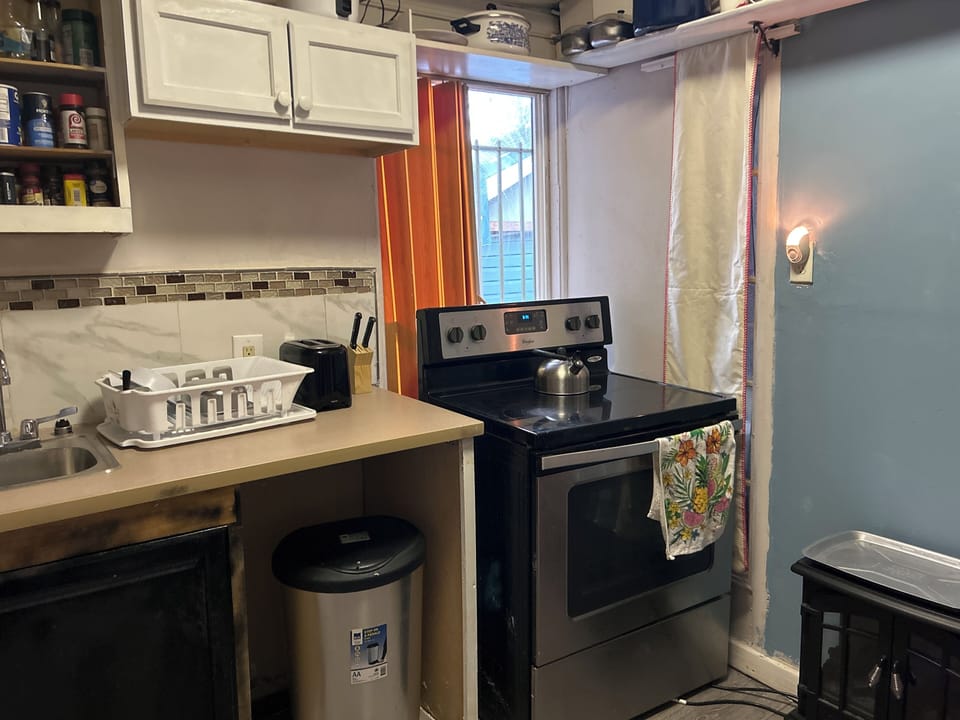 Kitchen with stove and utensils