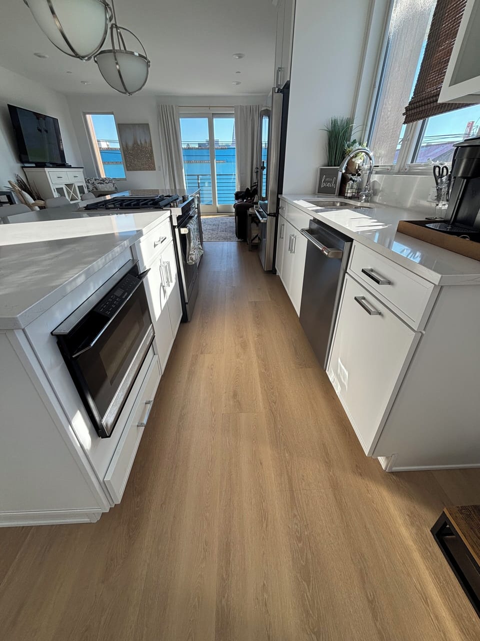 Kitchen: beverage fridge, dishwasher, microwave, oven