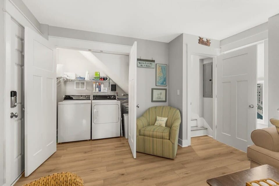 Lower level laundry closet with washer and dryer for added convenience.