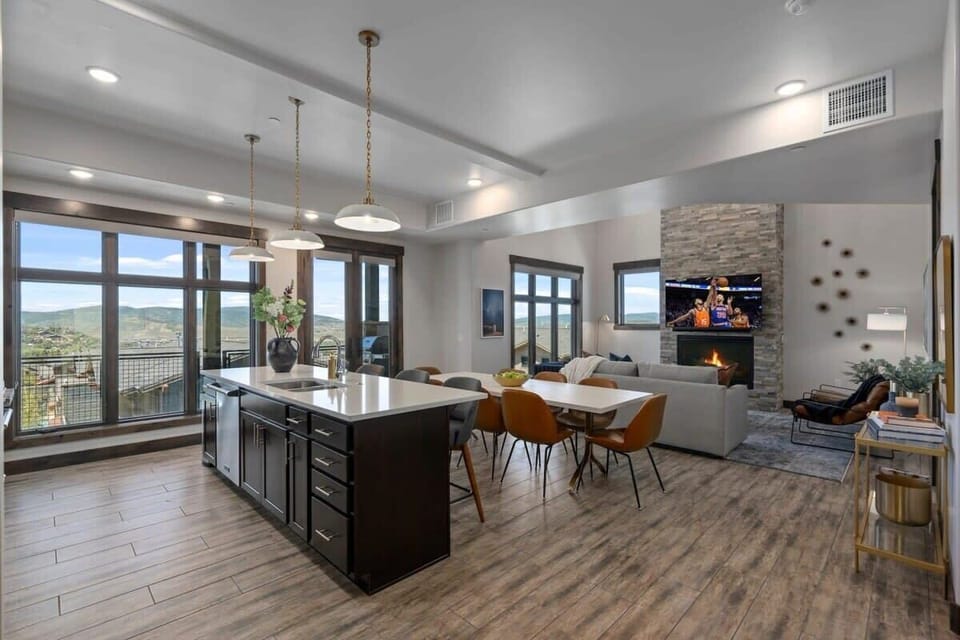  Bright open-concept design blends kitchen, dining, and living.