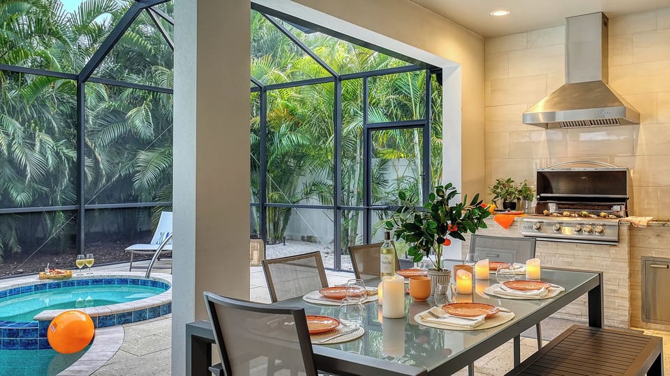 Alfresco dining for six beside the pool, paired with a commercial-grade Blaze grill for everything from easy family dinners to leisurely evenings under the palms.