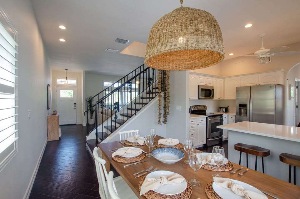 Dining table comfortably seats 6 plus 3 at the breakfast bar.