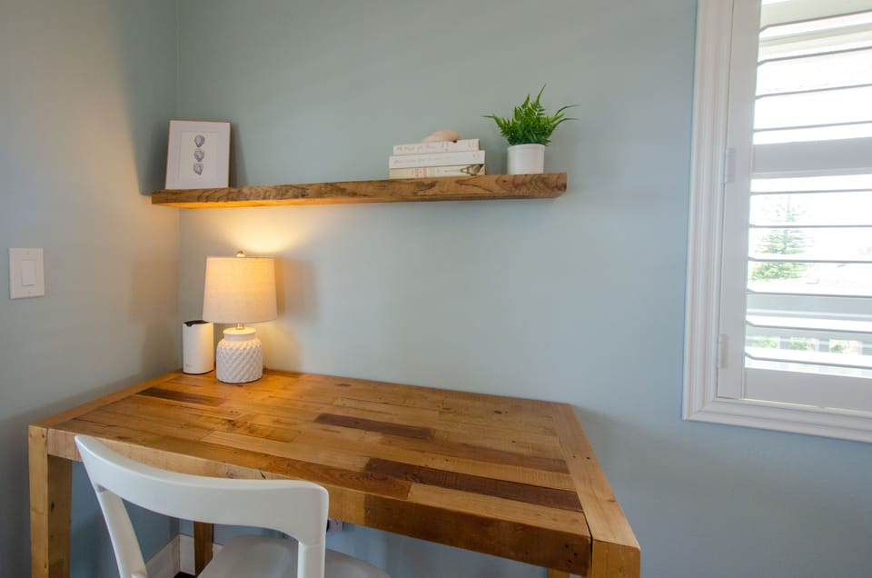 Private desk area in primary bedroom with Wifi extender for high speed internet.