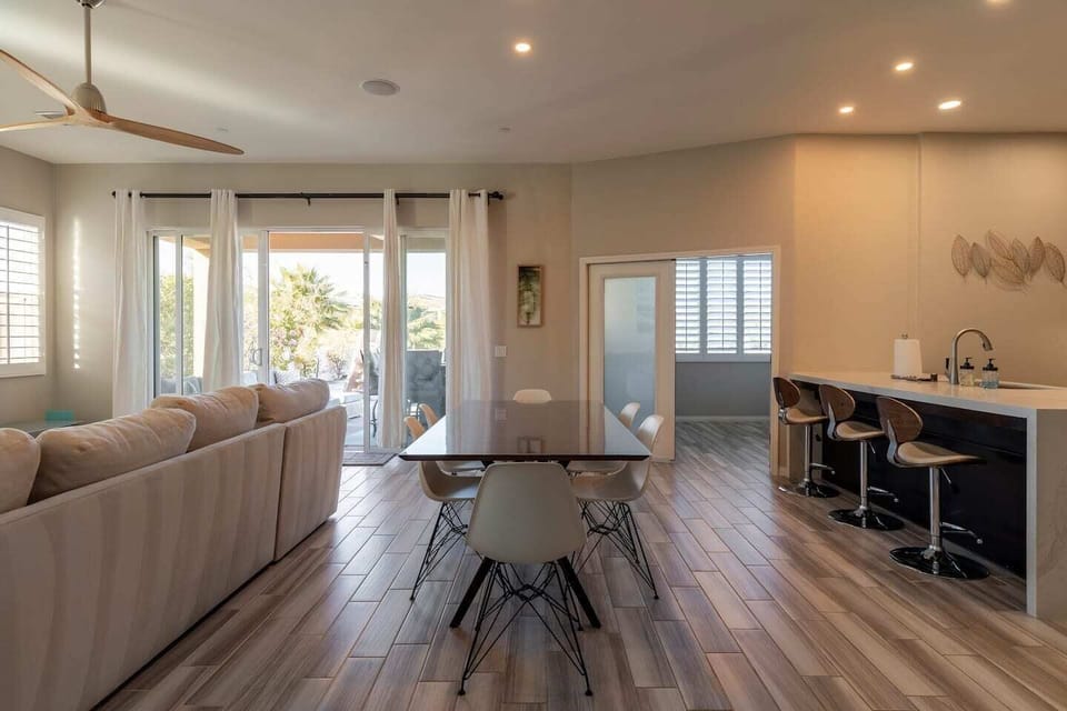 Bright, airy great room with a warm fireplace and breezy coastal touches
