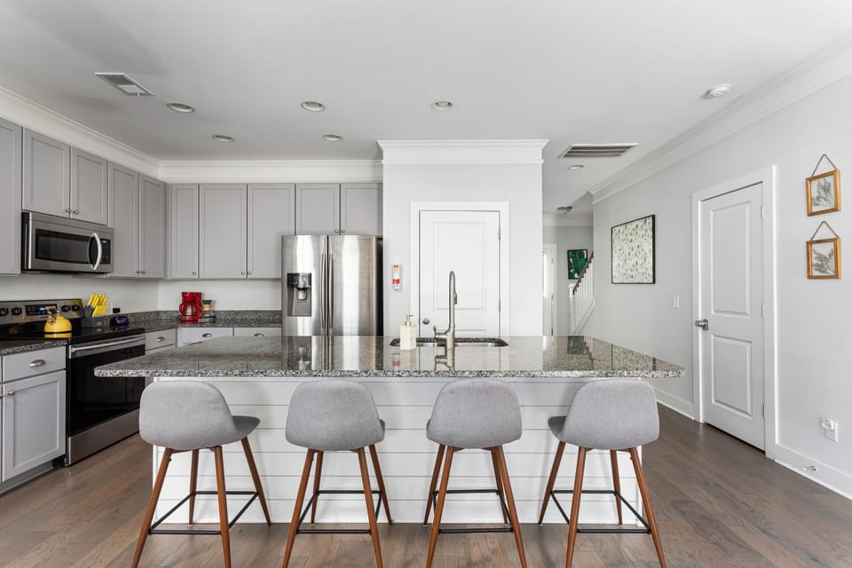 Kitchen island with 4 barstools for extra seating and eating accommodations. 