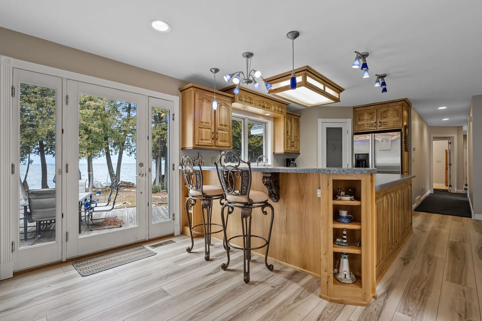 Eat-in kitchen opens to the patio and overlooks the bay of Green Bay