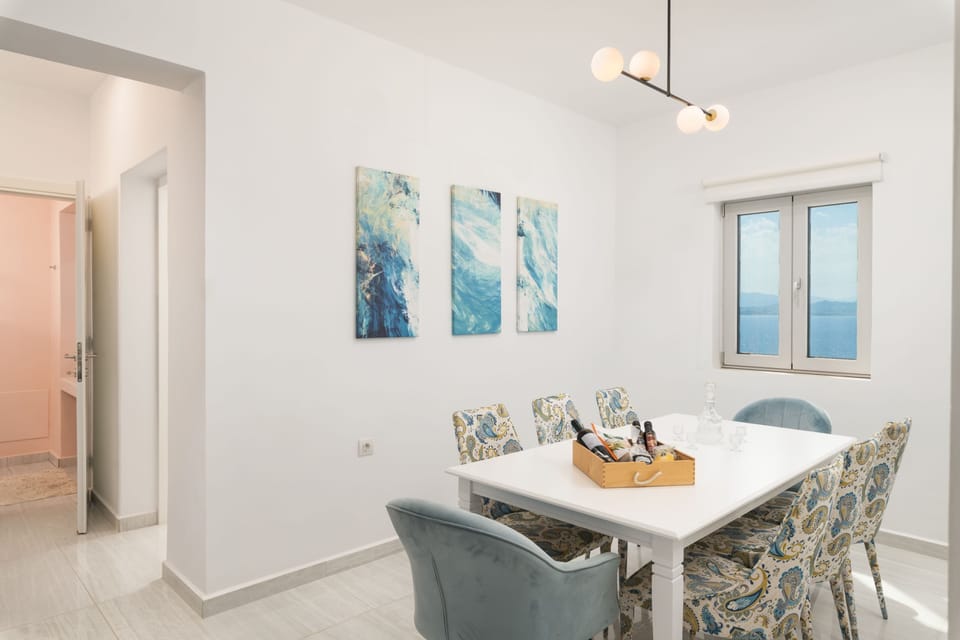 Adjacent indoor dining table for 8, inviting you to share a homemade meal with your loved ones.