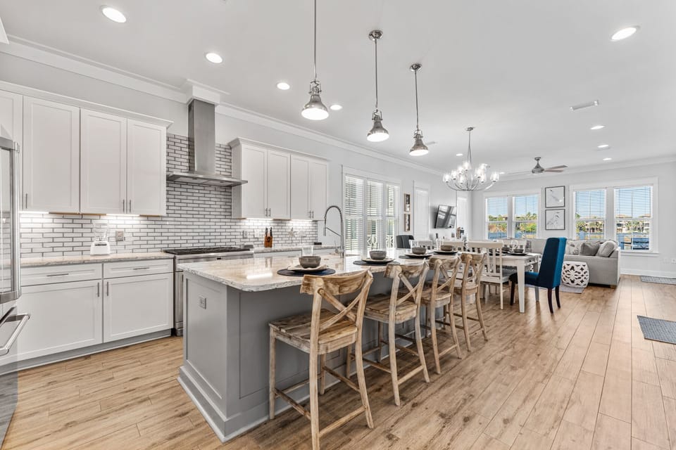 Your spacious open-concept kitchen invites culinary adventures with gleaming countertops, modern appliances, and a stunning island for gathering.