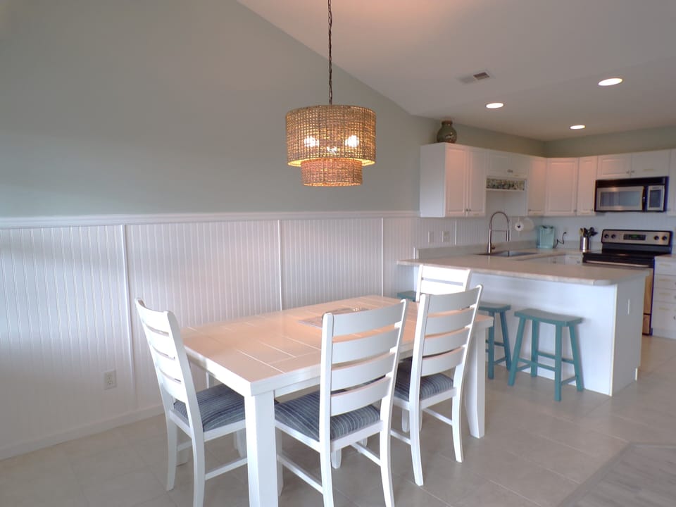 New Kitchen & Dining table with 4 chairs and bench to seat 6.