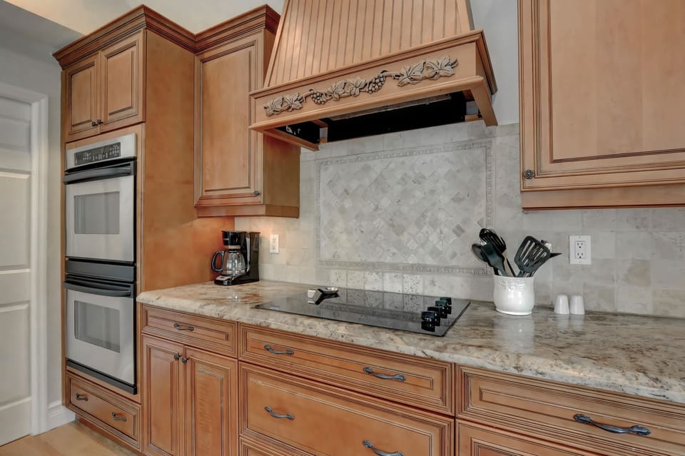 Our Kitchen Features a Double Oven, a Cook Top and Stainless Steel Appliances