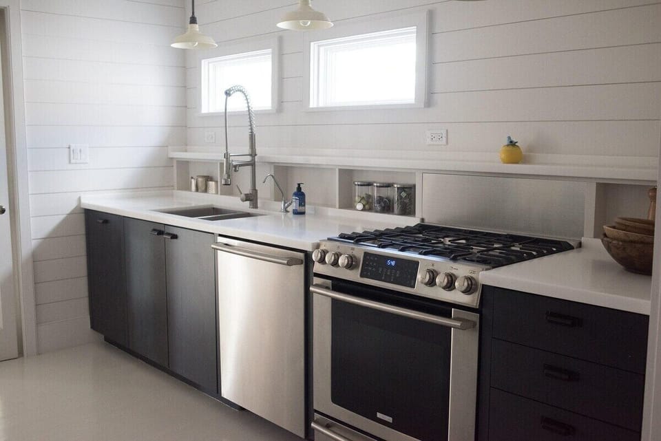 Kitchen - Dishwasher, sink, range.