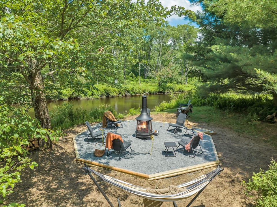 Enjoy direct backyard access to the Lehigh River, where calm, flowing water creates a serene and scenic backdrop for your Pocono getaway