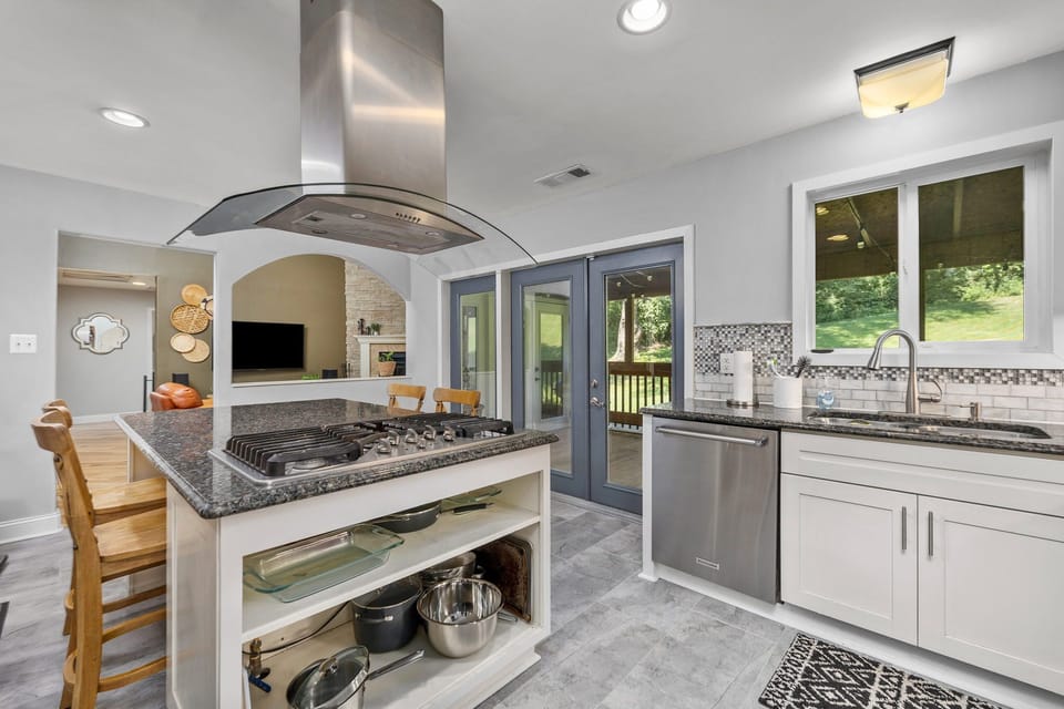 The kitchen contains all of the utensils and appliances needed to prepare meals