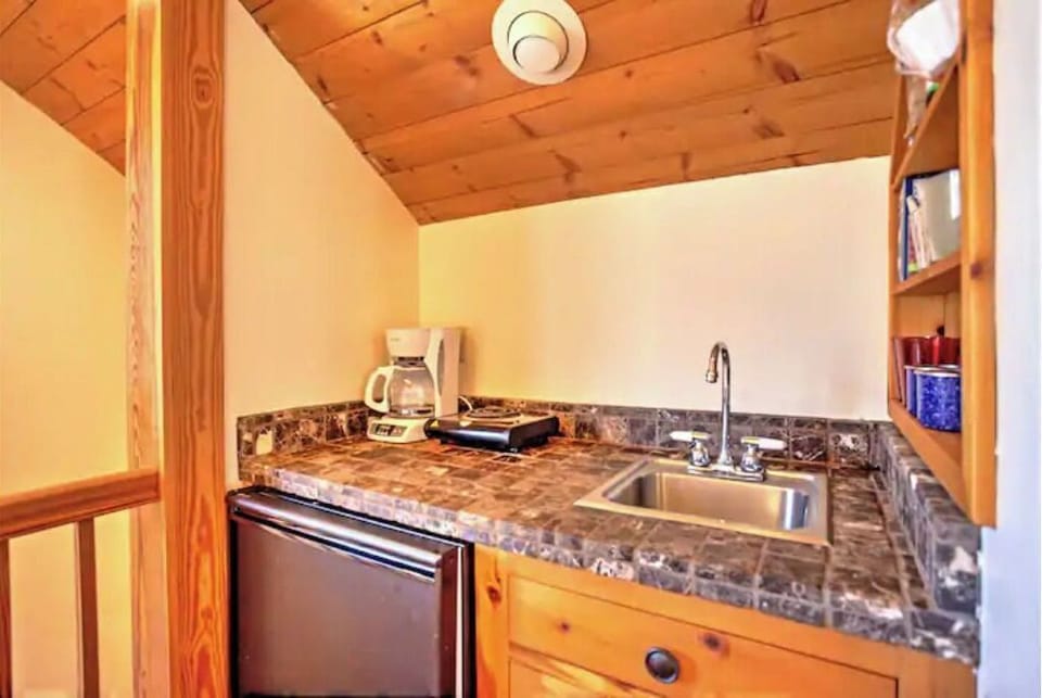 The Kitchenette has a sink, refrigerator, Mr. Coffee, Microwave, toaster-oven,  
