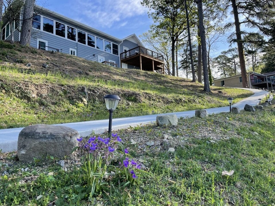 Paved path from rear of house to the swim dock