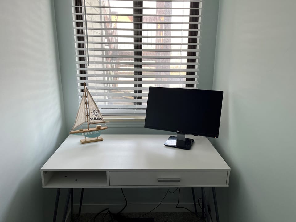 Dedicated office space with extra monitor