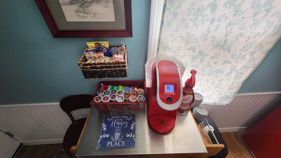 Keurig with assortment of coffee, teas, biscotti, biscuits,creamers, non dairy