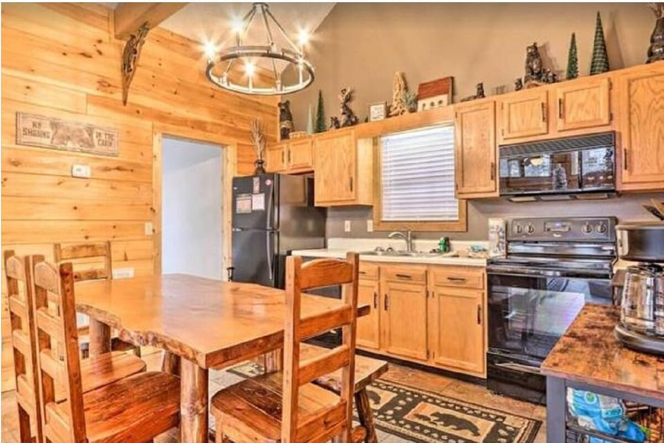 Your rustic kitchen blends charm with convenience - wood cabinets, sleek counters, and full appliances await your culinary adventures.