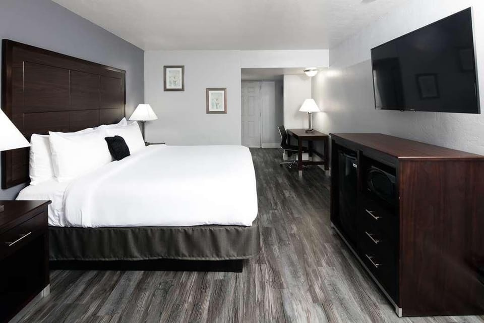Settle in with a wide layout, TV, desk, and comfort.