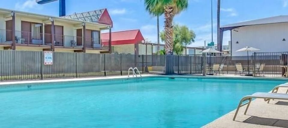 Dive into sparkling pool time and lounge under blue skies.