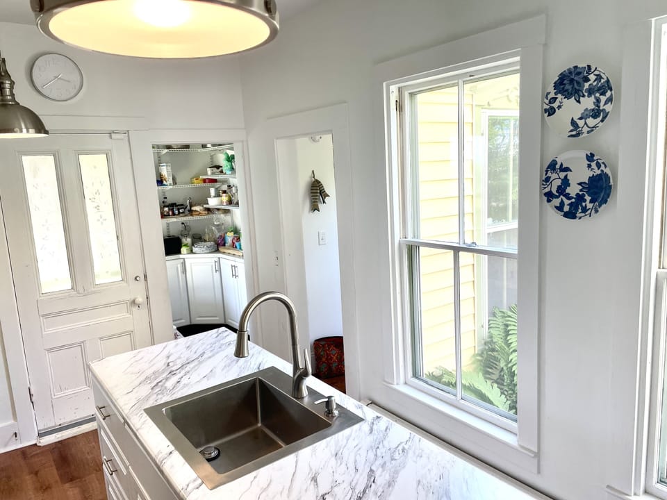 Kitchen view into large pantry