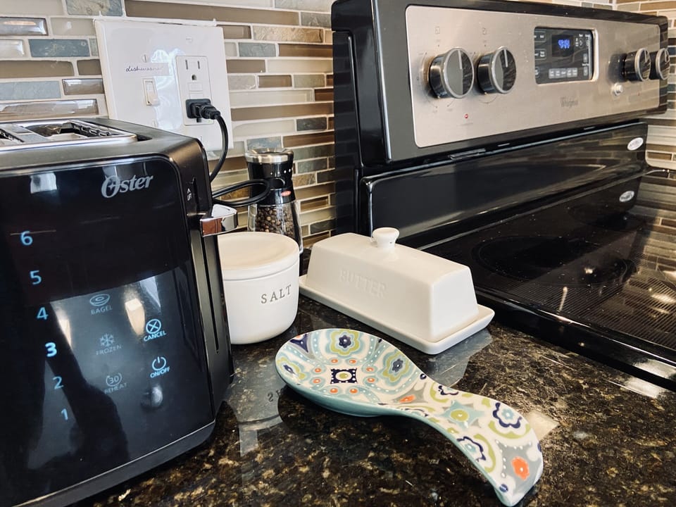 Toaster, Ninja blender, slow cooker, KitchenAid hand mixer, Nordic bakeware