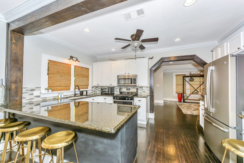 Full spacious kitchen with all-in-one fridge, gas range stove, microwave & oven.